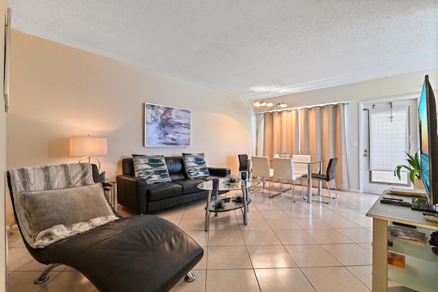 living room with light tile patterned floors and a textured ceiling