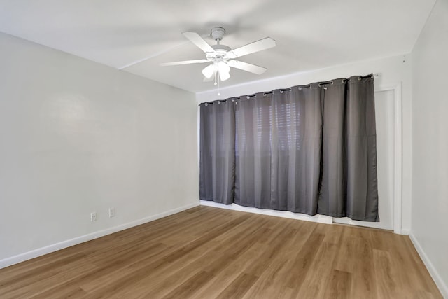 unfurnished room featuring hardwood / wood-style flooring and ceiling fan