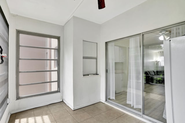 bathroom with tile patterned floors and ceiling fan