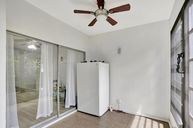 bathroom with tile patterned flooring and ceiling fan