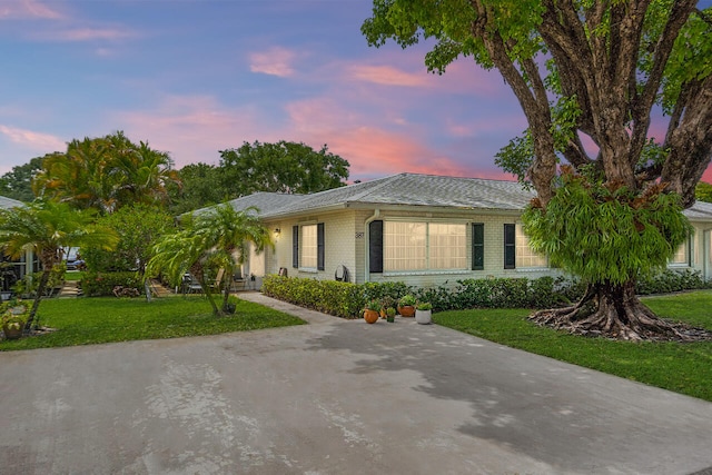 view of front of home with a lawn