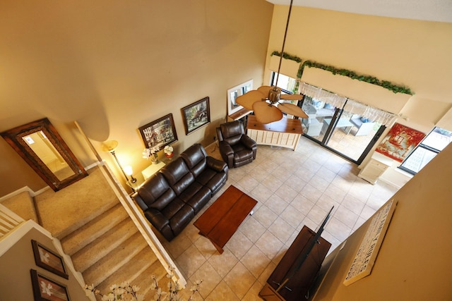 interior space with tile patterned flooring and a towering ceiling