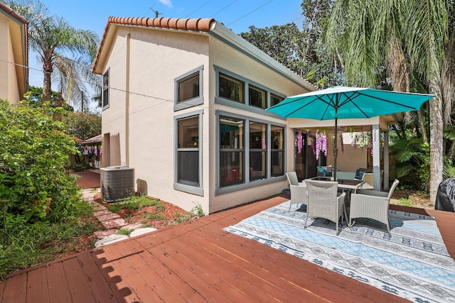 wooden terrace featuring cooling unit