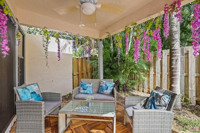 view of patio with outdoor lounge area and ceiling fan