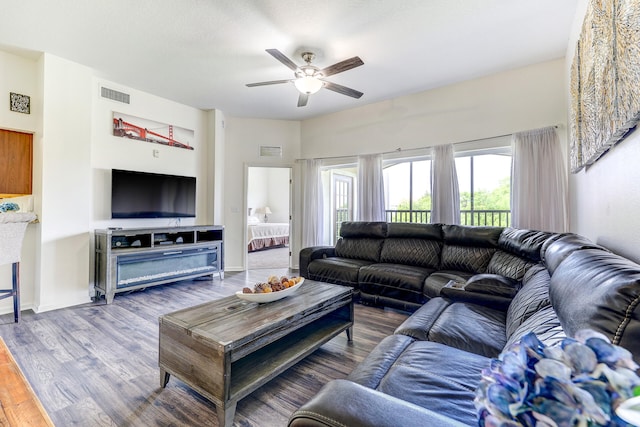 living room with hardwood / wood-style flooring and ceiling fan