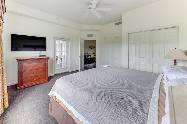 bedroom featuring dark colored carpet and ceiling fan