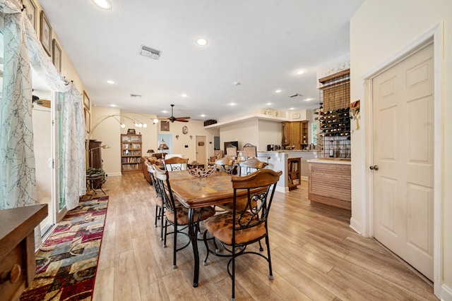 dining room featuring ceiling fan and light hardwood / wood-style floors