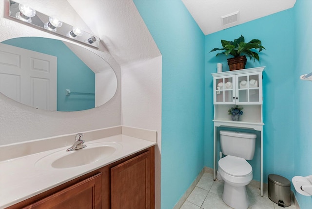 bathroom featuring tile patterned flooring, visible vents, vanity, and toilet