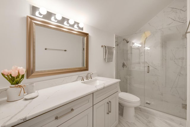 bathroom featuring vanity, toilet, a shower with shower door, and vaulted ceiling