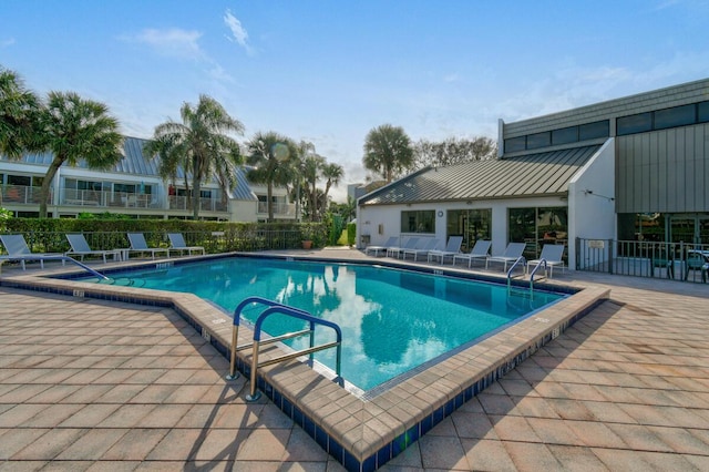 view of swimming pool with a patio