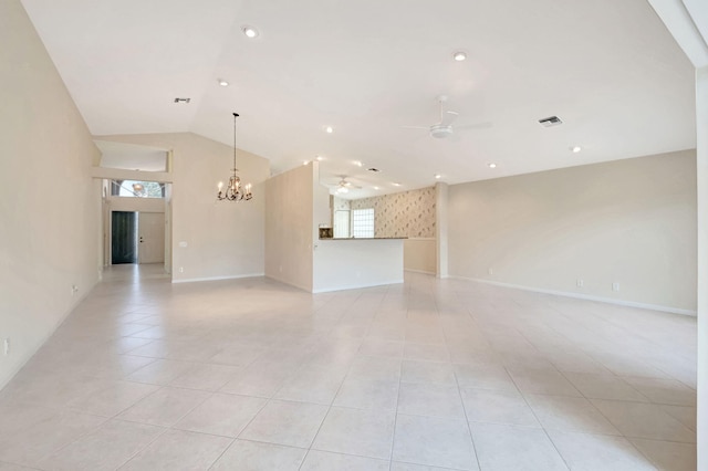 unfurnished living room with ceiling fan with notable chandelier, vaulted ceiling, and light tile patterned flooring