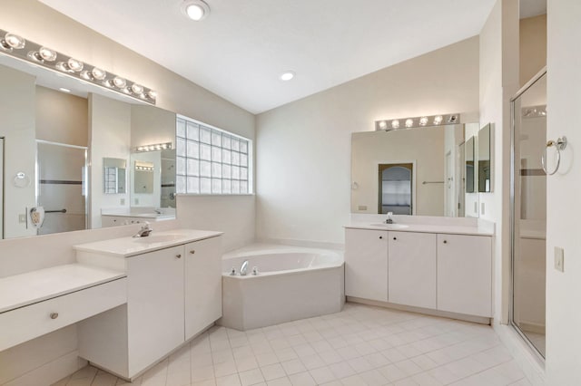 bathroom featuring tile patterned floors, vanity, separate shower and tub, and lofted ceiling