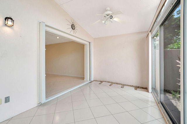 unfurnished sunroom with ceiling fan and vaulted ceiling