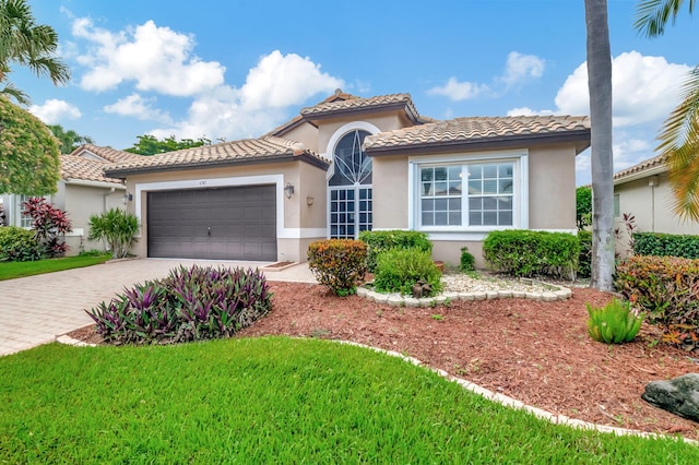 mediterranean / spanish-style home featuring a garage