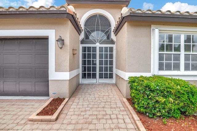 property entrance with a garage