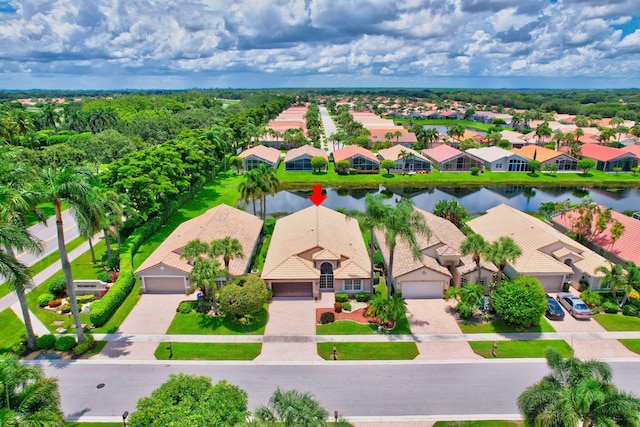 birds eye view of property featuring a water view