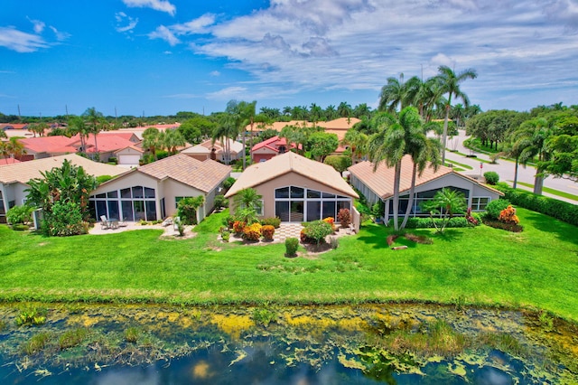 birds eye view of property with a water view