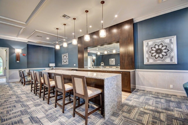 bar with coffered ceiling, light stone countertops, ornamental molding, decorative light fixtures, and light colored carpet