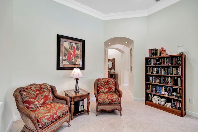 sitting room with crown molding and light tile patterned flooring