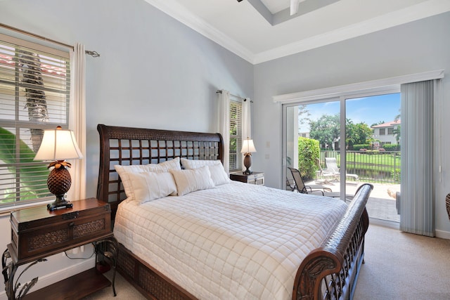 carpeted bedroom featuring access to exterior and ornamental molding