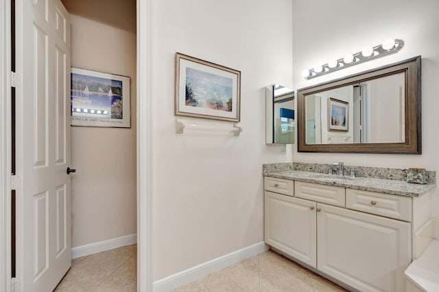 bathroom with tile patterned flooring and vanity