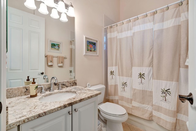 full bathroom featuring tile patterned floors, vanity, toilet, and shower / tub combo