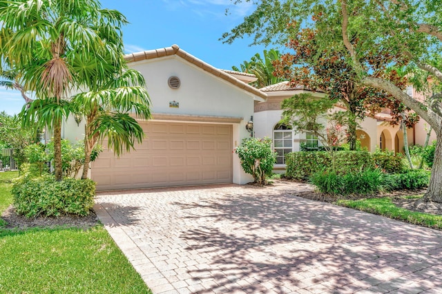 mediterranean / spanish-style home featuring a garage