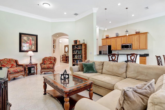 living room with crown molding and light tile patterned flooring