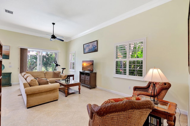 living room with ceiling fan, ornamental molding, and light tile patterned flooring