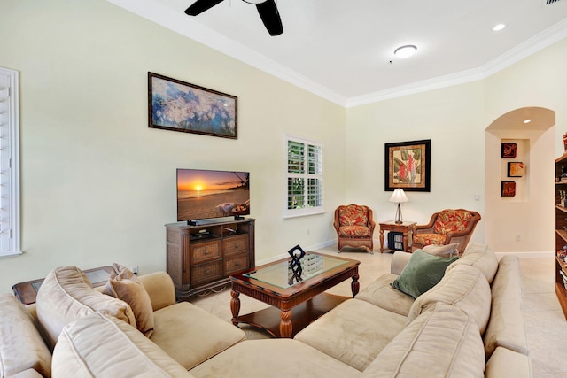 living room with ceiling fan, crown molding, and light tile patterned flooring