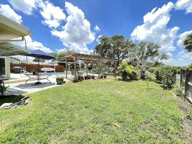 view of yard featuring a fenced backyard, a fenced in pool, a pergola, and a patio