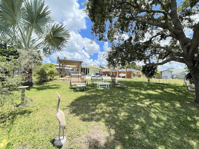 view of yard with fence and a pergola