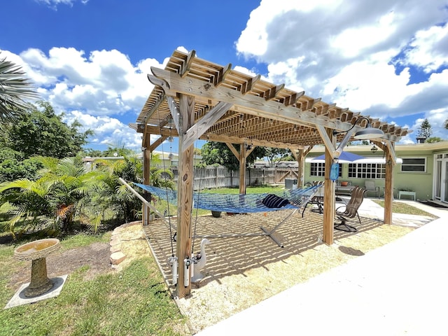 exterior space featuring fence and a pergola