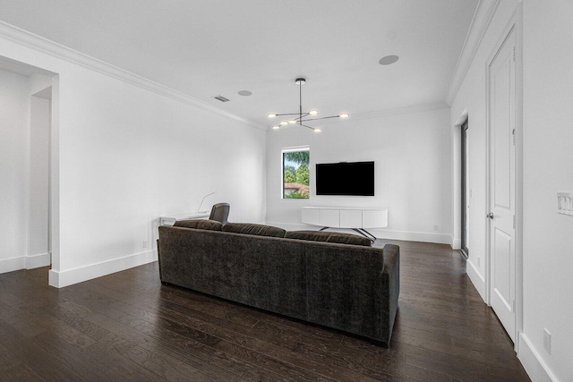 living room with dark hardwood / wood-style flooring, crown molding, and a notable chandelier