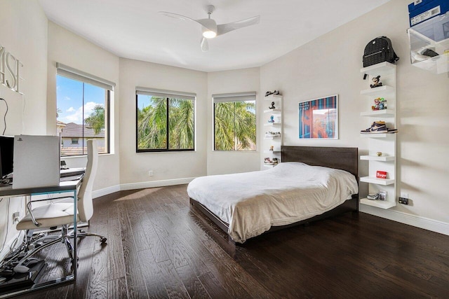 bedroom with ceiling fan and dark hardwood / wood-style flooring