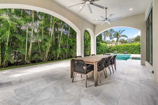 view of patio featuring ceiling fan