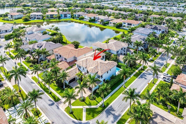 birds eye view of property featuring a water view