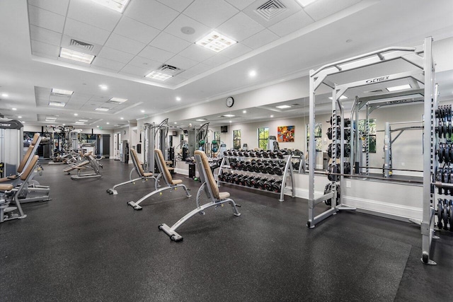 workout area with a paneled ceiling