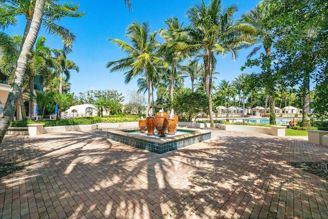 view of community with a patio and a swimming pool