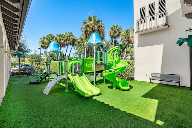 view of jungle gym with a lawn