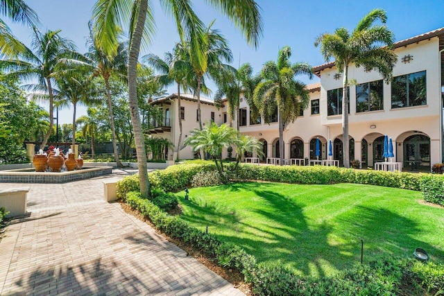 view of home's community featuring a lawn