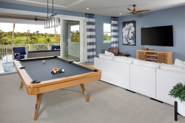 recreation room with ceiling fan, a water view, light colored carpet, and billiards