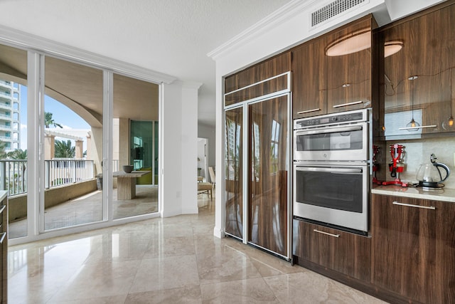 kitchen featuring decorative backsplash, ornamental molding, paneled fridge, stainless steel double oven, and dark brown cabinets