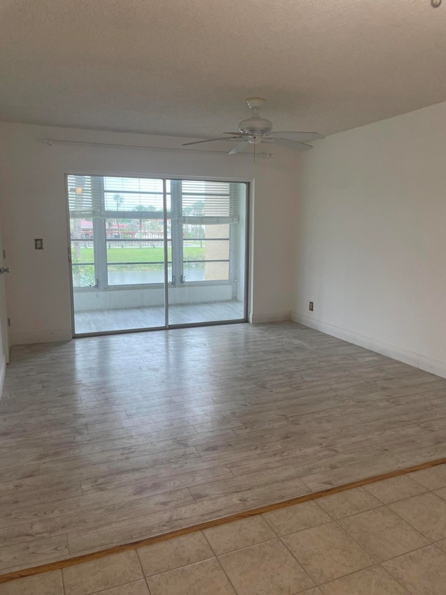 unfurnished room featuring light hardwood / wood-style flooring and ceiling fan