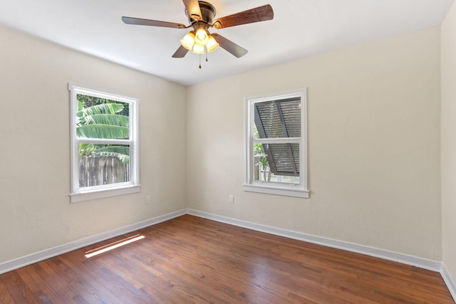 unfurnished room featuring ceiling fan and hardwood / wood-style flooring