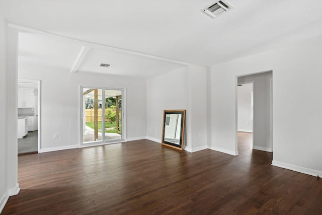 unfurnished living room featuring dark wood-type flooring