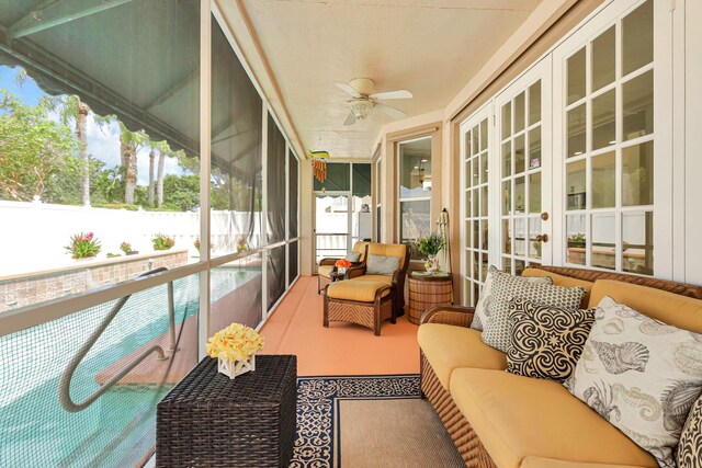 sunroom / solarium with ceiling fan