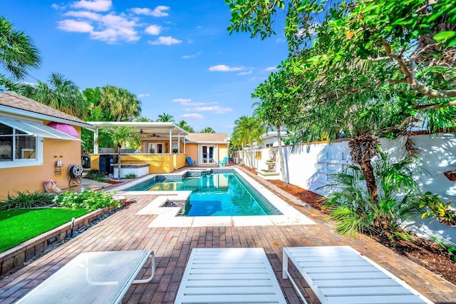 view of pool featuring a patio and ceiling fan