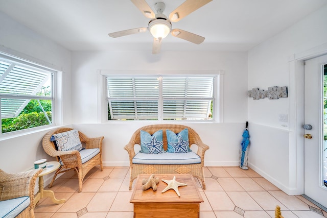 sitting room featuring ceiling fan and light tile patterned floors