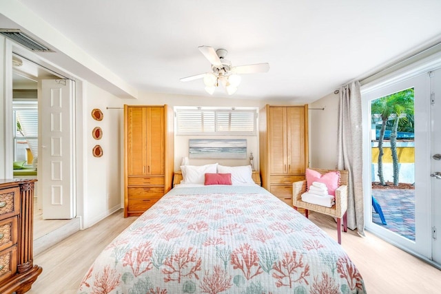 bedroom featuring access to exterior, light wood-type flooring, and ceiling fan